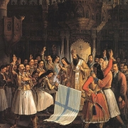 Biskup Germanos žehná praporu revoluce